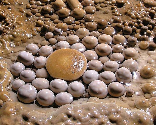 a small group of white stones in water