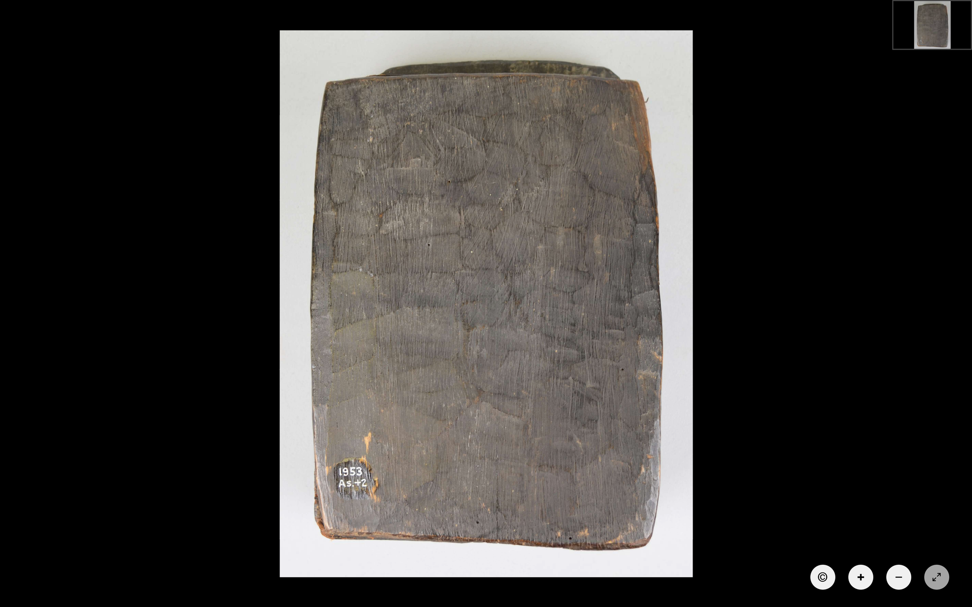 a book with a cover made of bark sitting on a white background