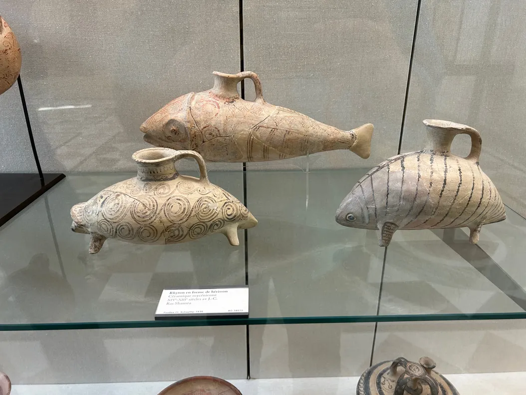 a set of small ceramic containers shaped like fish